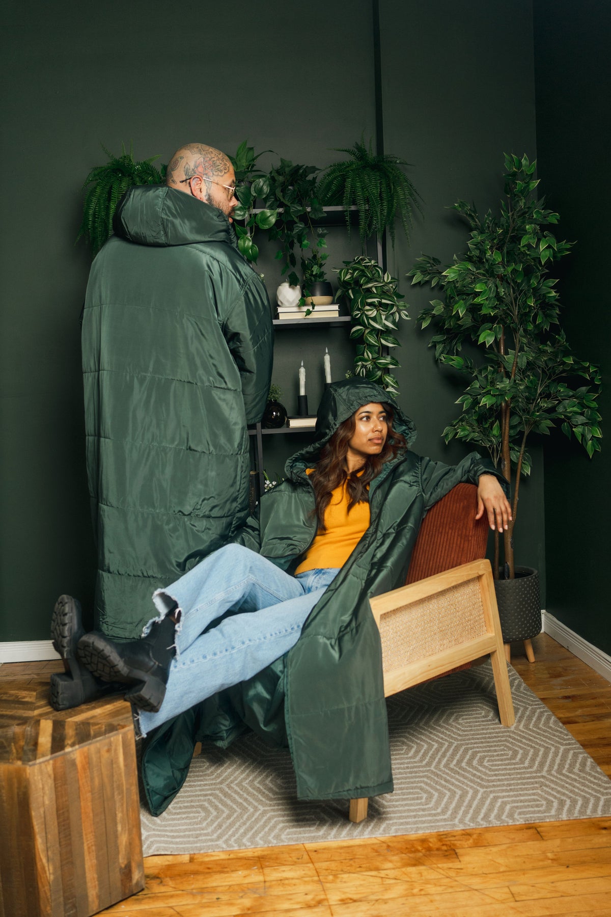 Two people wearing green Sittingsuits indoors
